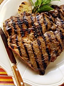 Barbecued lamb steak on plate