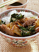 Duck with chard, sesame and rice; soy sauce