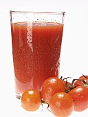 Glass of tomato juice and fresh cherry tomatoes