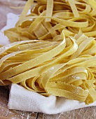 Home-made tagliatelle on white cloth