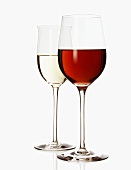 Red wine glass and white wine glass, half filled