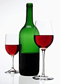 Red wine bottle and two different red wine glasses