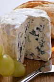 Blue cheese with grapes and baguette