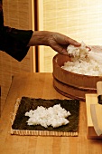 Preparing maki sushi