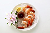 Shrimps with lemon and tomato dip; flower