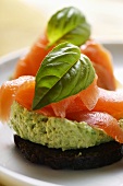 Pumpernickel rounds with salmon and basil