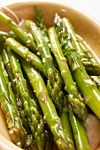 Marinated green asparagus with garlic (close-up)