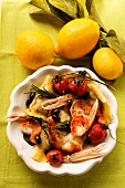 Ravioli with scampi, tomatoes and olives; lemons