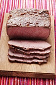 Roast beef on chopping board