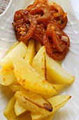 Fried potatoes and braised tomatoes