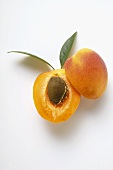 Apricot, halved, with leaves