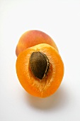Whole apricot and half an apricot
