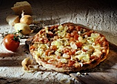 Pizza with cheese, onions and tomatoes