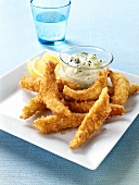 Breaded strips of fish with tartare sauce