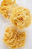 Various home-made pastas in plastic containers