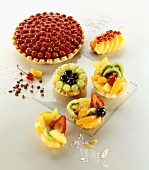 Cherry cake and assorted small cakes with fruit