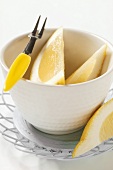 Lemon wedges in small bowl