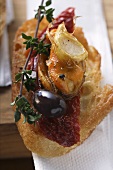 Crostini with seafood and dried tomatoes