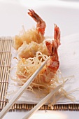 King prawns, fried in rice noodles, on bamboo mat