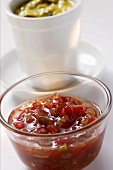 Pepper relish in small bowl, mustard relish behind it