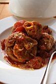 Osso buco with tomatoes