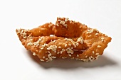 A fried pastry with honey and sesame (Morocco)