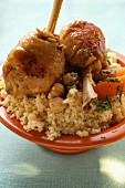 Chicken legs and vegetables on couscous