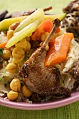 Roast pigeon with vegetables on noodles