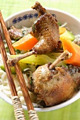 Roast pigeon with vegetables on noodles (Asia)