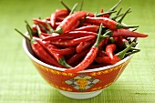 Red chili peppers in Asian bowl