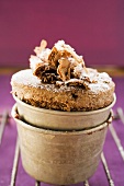 Chocolate soufflé with chocolate curls and icing sugar