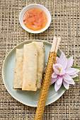 Three spring rolls and chili dip