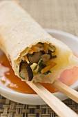 Spring roll on chili dip