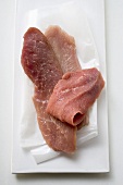 Pork, turkey and veal escalopes on paper