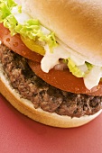 Hamburger with tomato, lettuce and mayonnaise