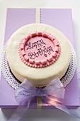 Birthday cake on pale purple box