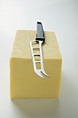 Semi-hard cheese with cheese knife