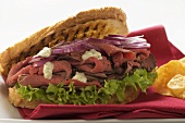 Roast beef and onion sandwich, crisps