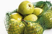 Green pears in net