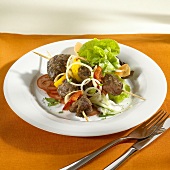 Lamb kebabs with salad