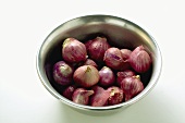 Several shallots in dish