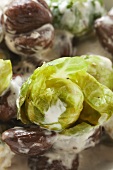 Brussels sprouts with chestnuts and cream sauce (close-up)