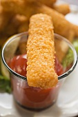 Fish finger with ketchup
