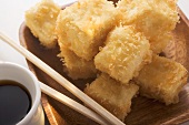 Breaded tofu cubes with soy sauce (Asia)