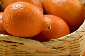 Small oranges in basket