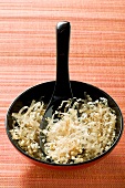 Bonito flakes in bowl with spoon
