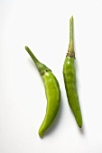 Two green chili peppers