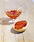 Apricot and redcurrant jam on roll and in glass dish