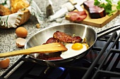 Fried egg with Black Forest ham in a frying pan