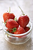 Fresh strawberries in a small bowl